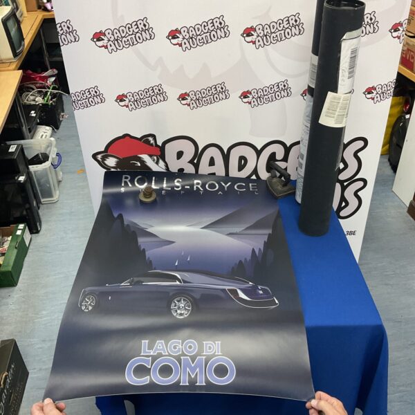 Rolls Royce Lago di Como poster displayed on a table.