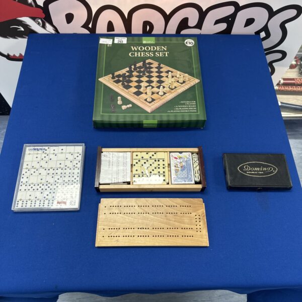 Vintage wooden chess set with dominoes and cribbage pieces.