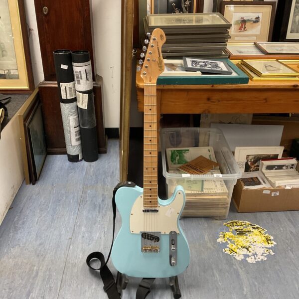 Vintage baby blue V75 electric guitar with single coil pickup.