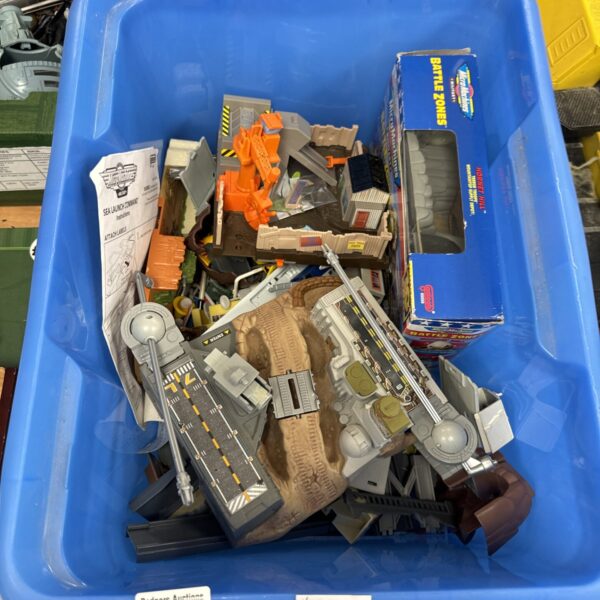 Vintage Micro Machines lot with various vehicles and playsets.