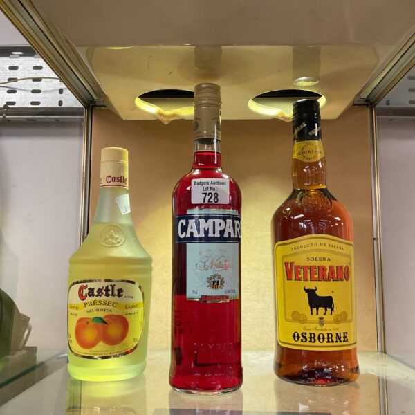 Alcohol bottle lot featuring Campari, Veterano, and Castle Presec.