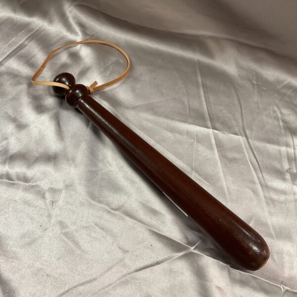 Vintage wooden police truncheon for law enforcement.