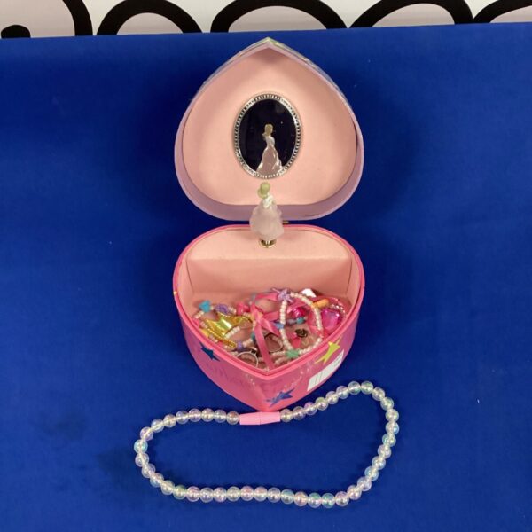 Pink vintage Barbie musical jewellery box with open lid.