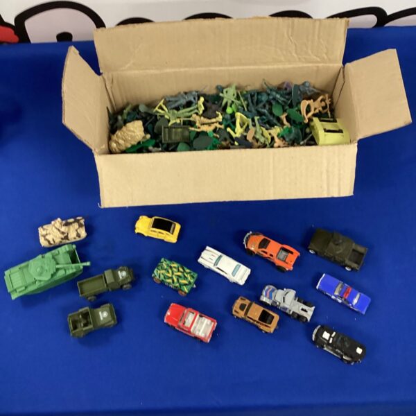 Vintage lot of army figures and diecast vehicles for collectors.