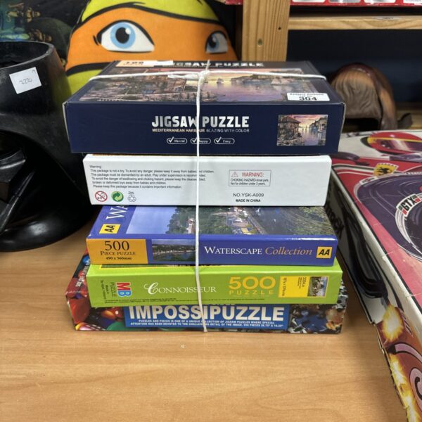 Vintage lot of five jigsaw puzzles, including MB Games puzzle.