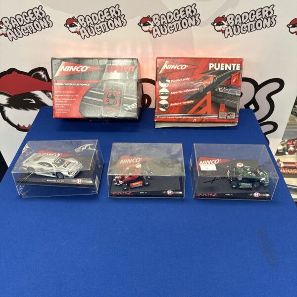Overview of Ninco slot racing set with accessories and car bodies.