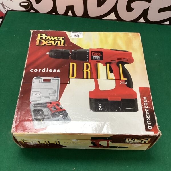 Vintage Power Devil 24V cordless drill set in carrying case.