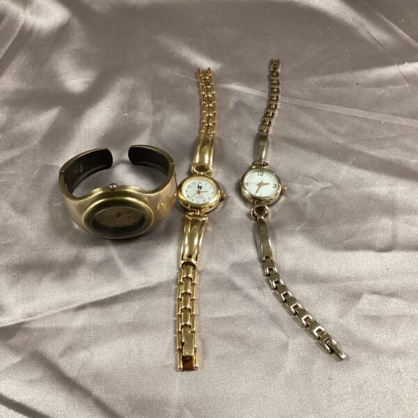 Three ladies’ gold-tone wrist watches in a lot.