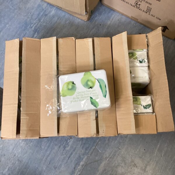Four boxes of Emma Bridgewater tins stacked together.