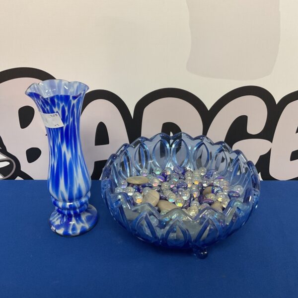 Vintage blue glass bowl and vase set with swirl pattern.