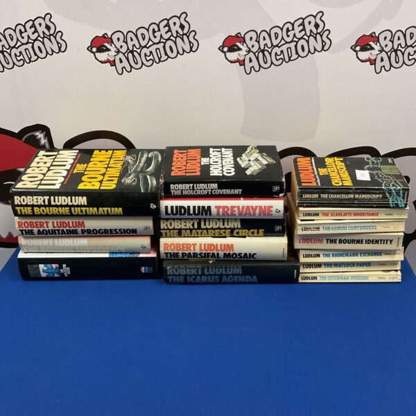 Robert Ludlum book collection featuring paperback and hardback thrillers.