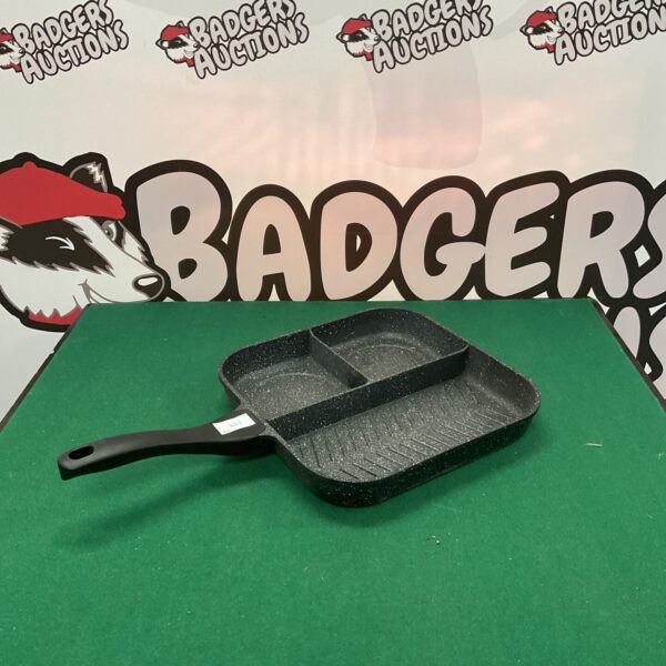 Grey steel non-stick frying pan with black handle.