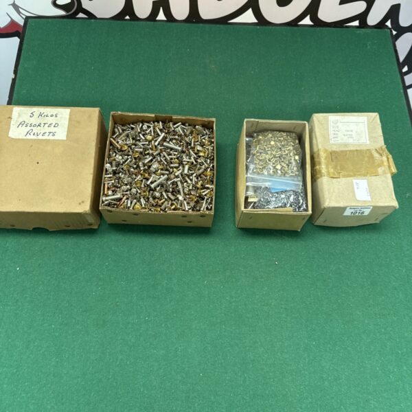 Two boxes of assorted metal rivets for DIY and repair projects.