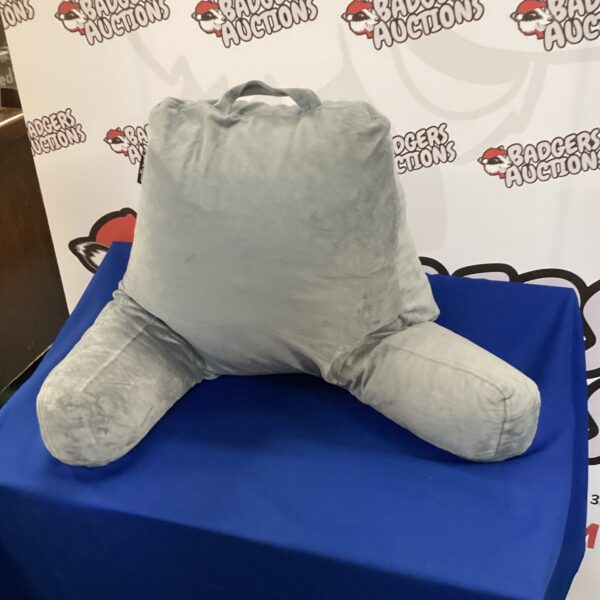 Pair of reading support cushions on a white surface.