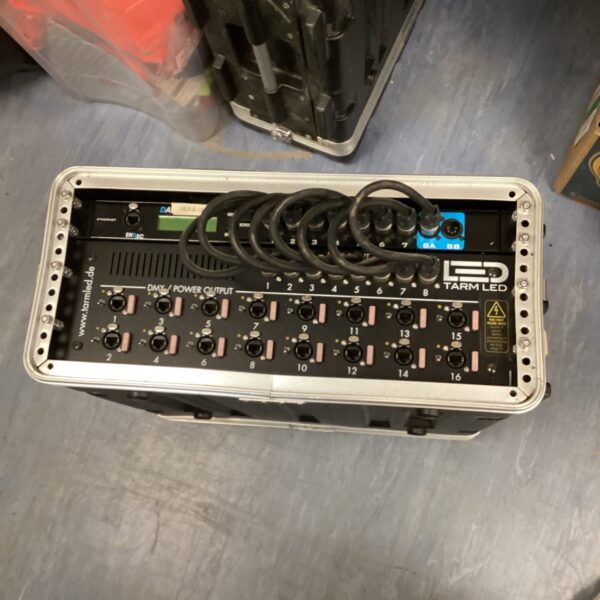 Front view of a used Tarm LED power unit with multiple outlets.