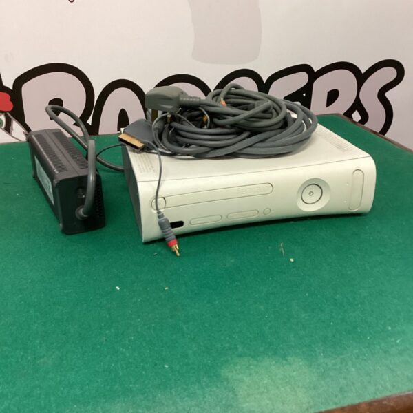 Black Xbox 360 E gaming console with cables included.