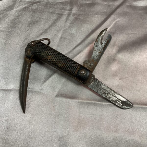 Open WWII US Army jack knife showing multiple tools.