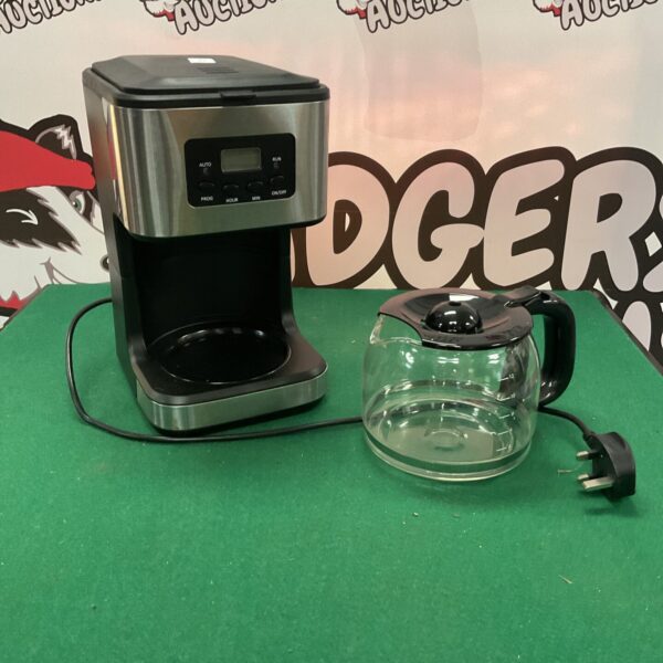 Black electric drip coffee machine with glass carafe.