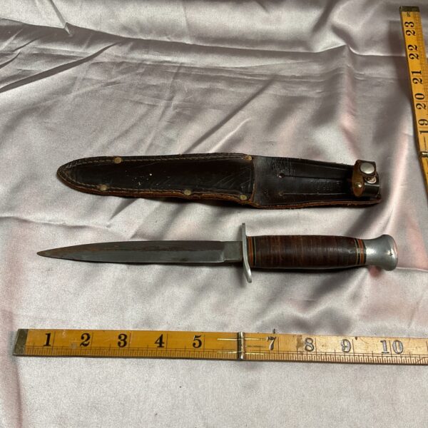 Vintage stacked leather handle knife with sheath.