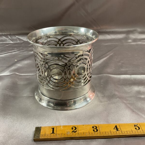 Elegant Ralph Lauren silverplate candle holder with pierced design.
