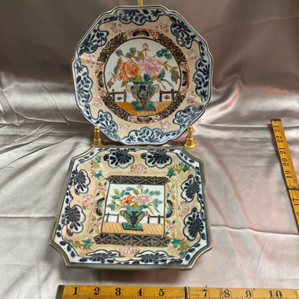 Antique Chinese Canton plates with floral hand-painted designs.