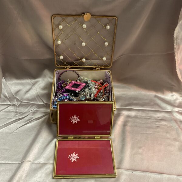 Vintage costume jewellery box with mixed lot of jewellery inside.