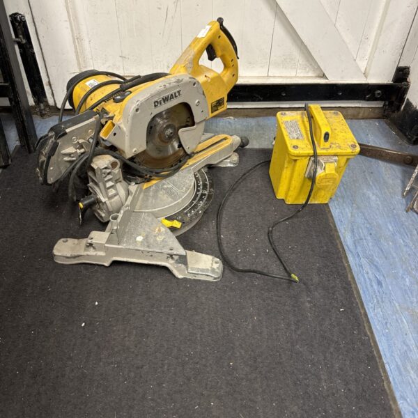 Dewalt 110v mitre saw with transformer block, ideal for DIY projects.