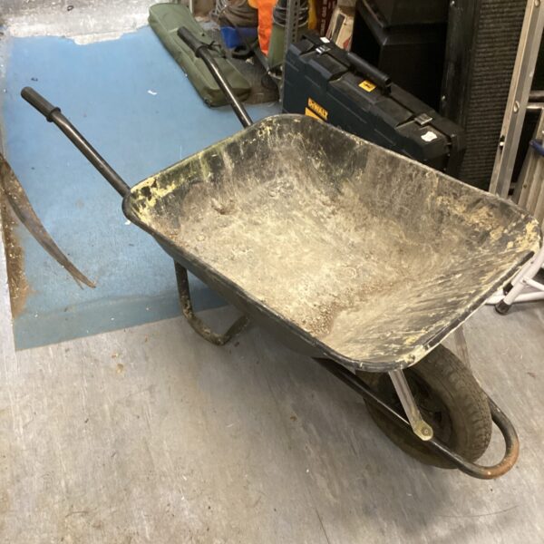 Rusted vintage wheelbarrow, a classic garden tool.