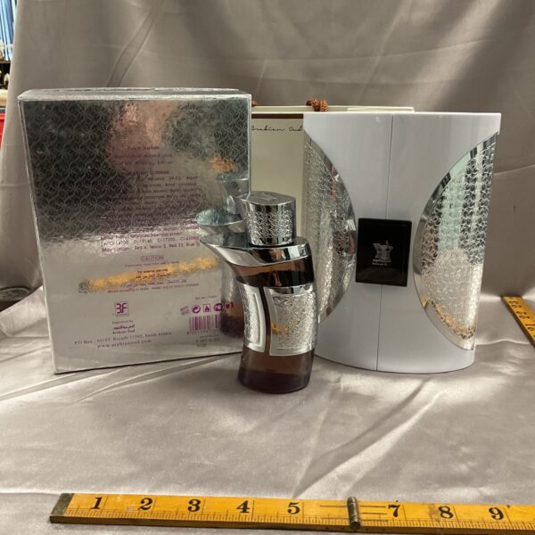 Arabian Oud perfume bottle and patterned box, luxury fragrance.