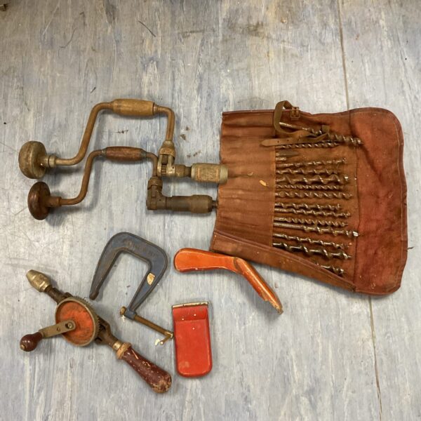 Vintage hand drill lot with brace and bits for woodworking.