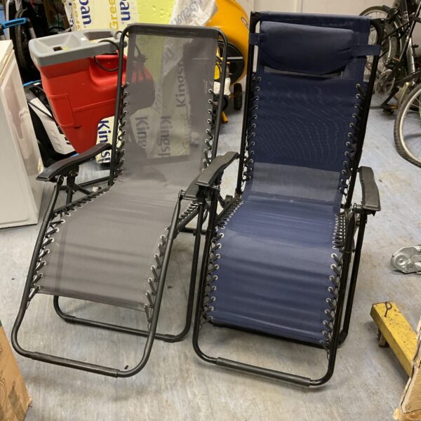 Pair of reclining sun loungers for garden or patio use.