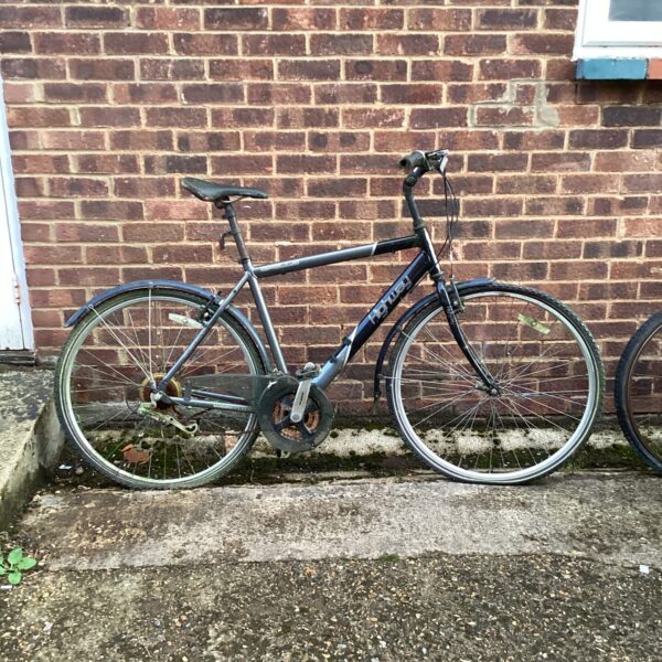 Side view of a used Apollo highway bike for sale.