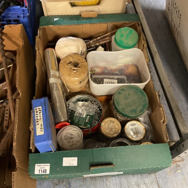 Mixed hardware lot with screws, nails, and fixings for DIY projects.