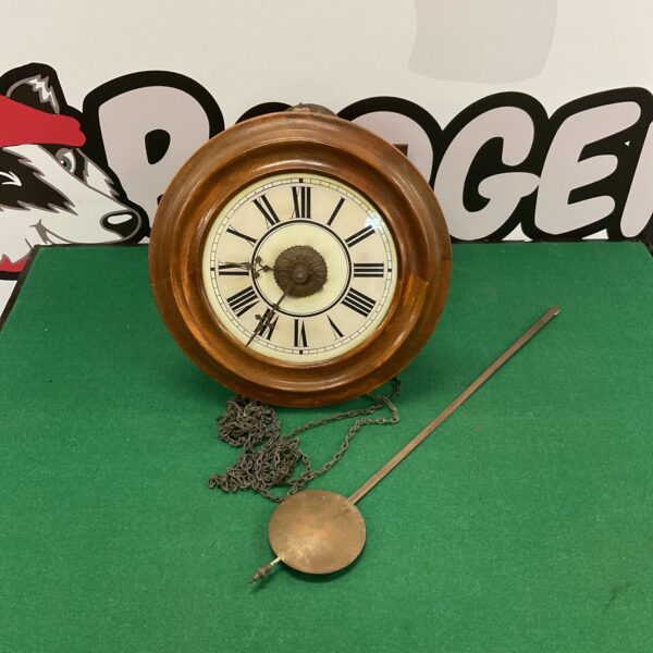 Antique porcelain wall clock with pendulum for restoration.