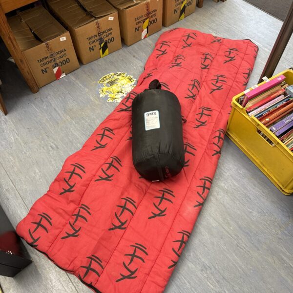Red patterned Sleepa 300 king size camping sleeping bag.