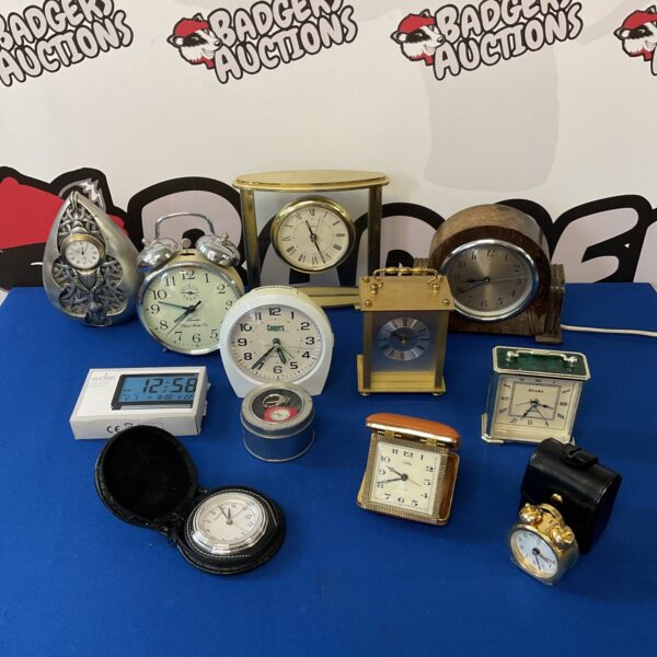 Antique clock collection featuring travel and carriage clocks.