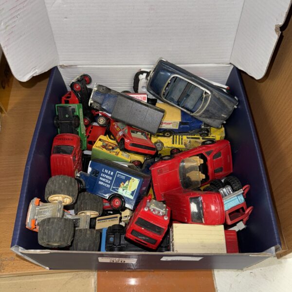Vintage diecast model cars in a mixed lot for collectors.