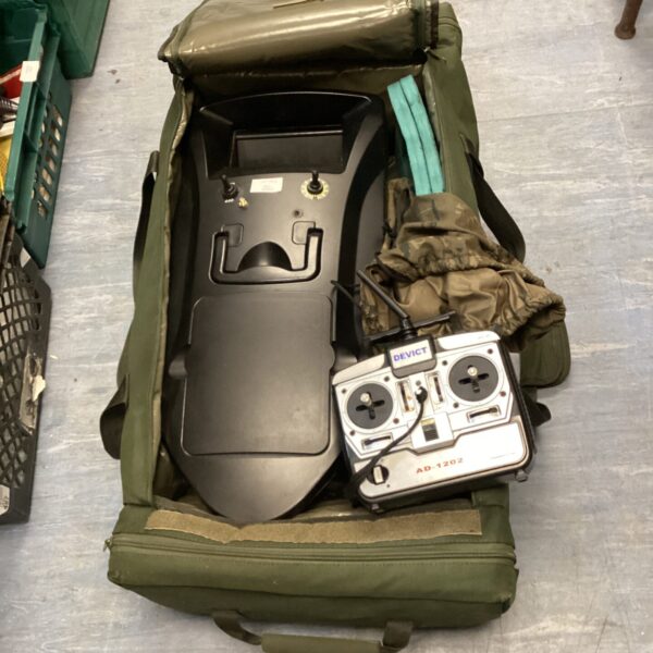 Green bait boat carryall for RC fishing equipment.
