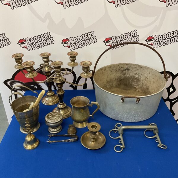 Vintage silver plate and brass candlesticks in a lot.