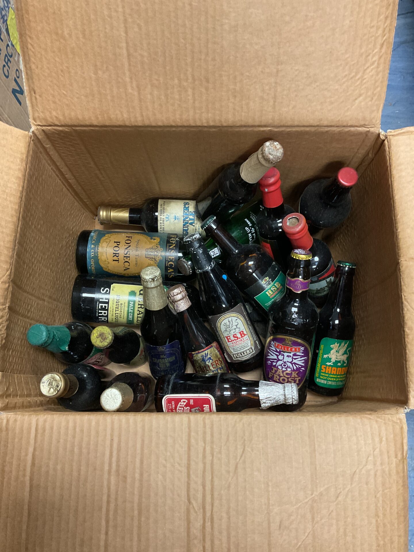 064 Collection of full vintage beer bottles including fullers