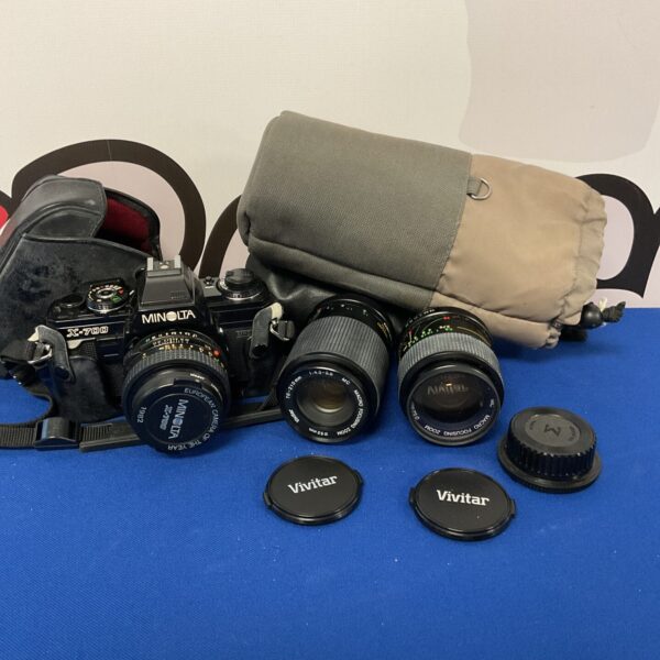 Vintage Minolta X-700 film camera with Hoya and Vivitar lenses.