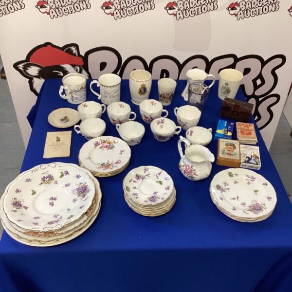 Collection of royal memorabilia china including teacups and figurines.