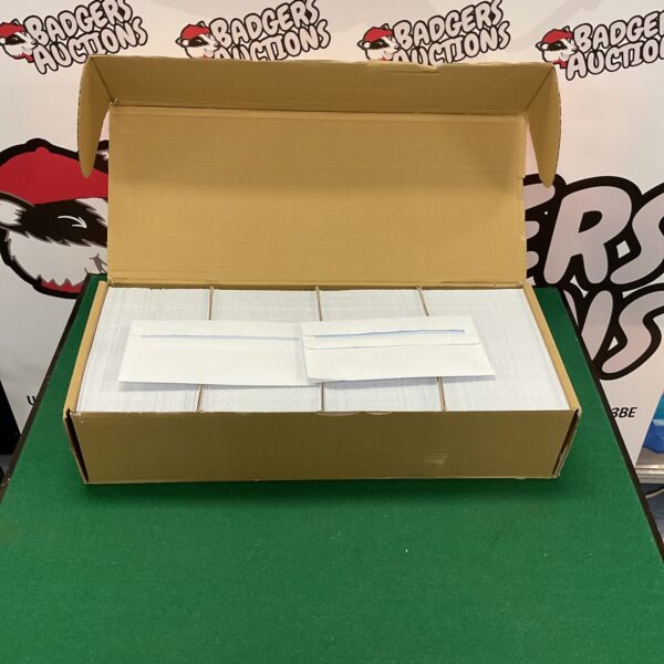 Stack of white self seal envelopes for mailing and office use.