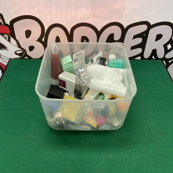 Mixed toiletries lot with various personal care products.