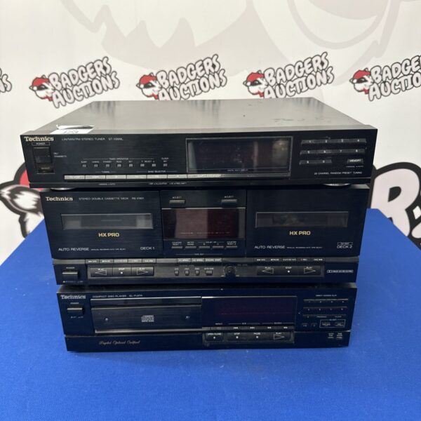 Vintage Technics stereo system with tuner, cassette deck, and CD player.