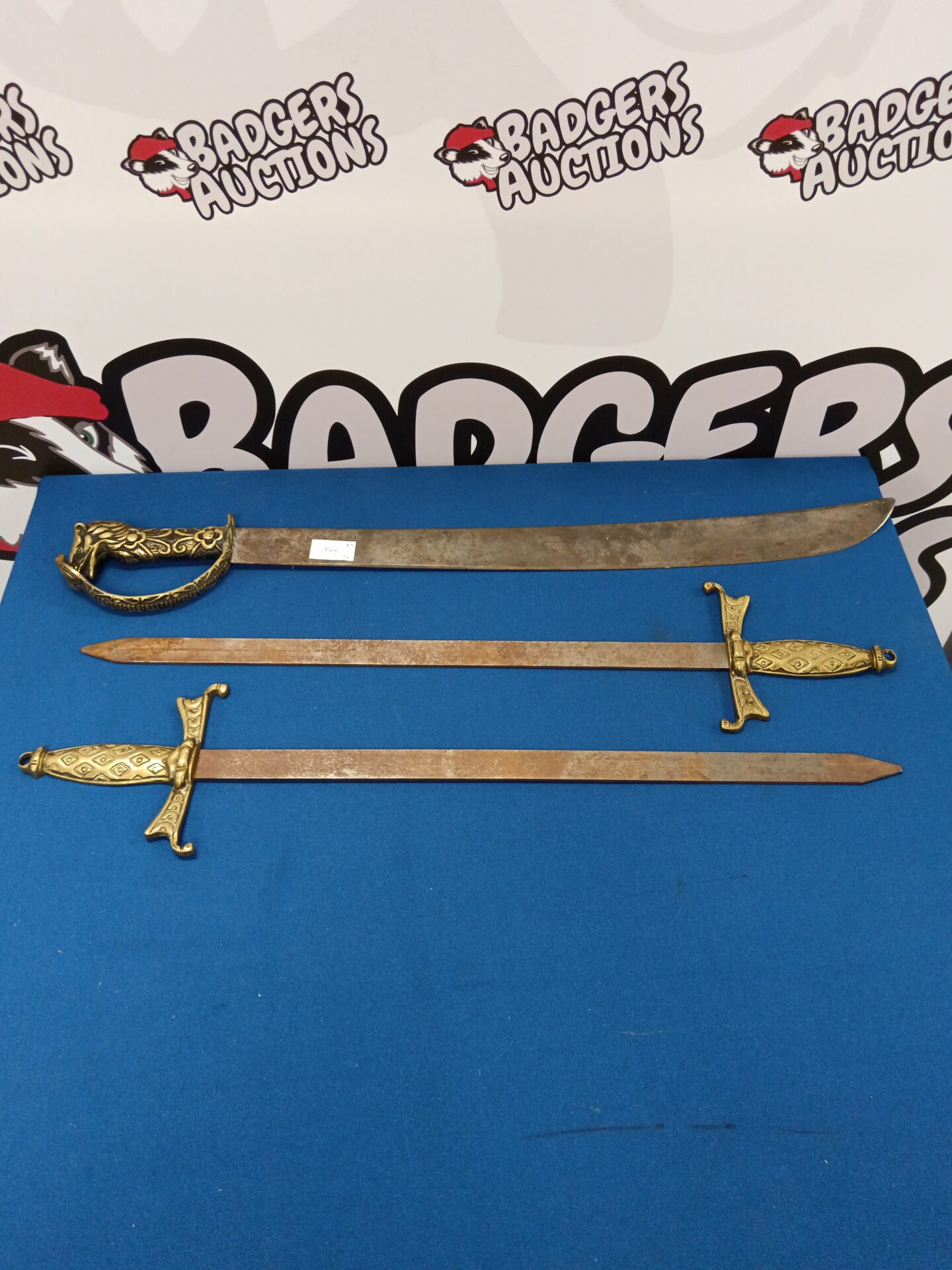 624 Three wall hanging swords