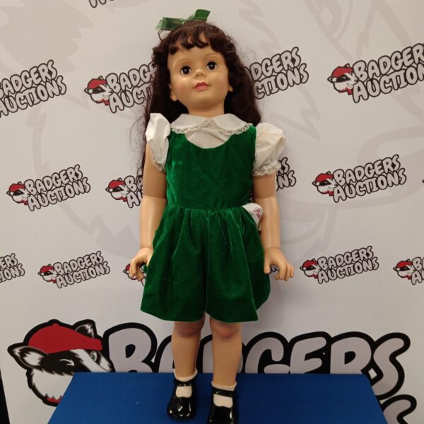 Vintage Patti Playpal doll in a green dress.