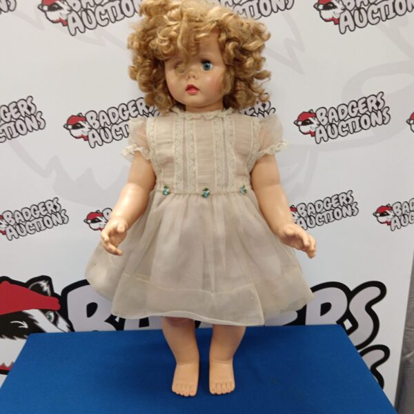 Vintage ADG collector doll, 30 inches tall, in a pale dress.