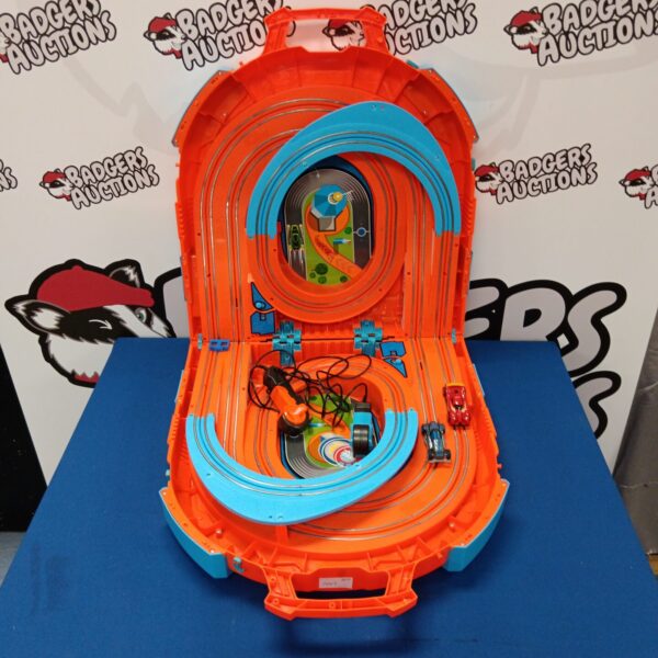 Open Hot Wheels carry case revealing a portable track and toy cars.