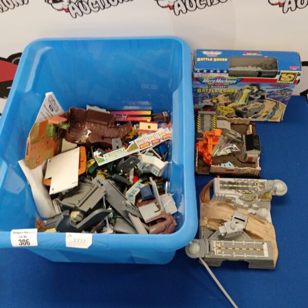 Vintage Galoob Micro Machines playsets and parts in a blue box.